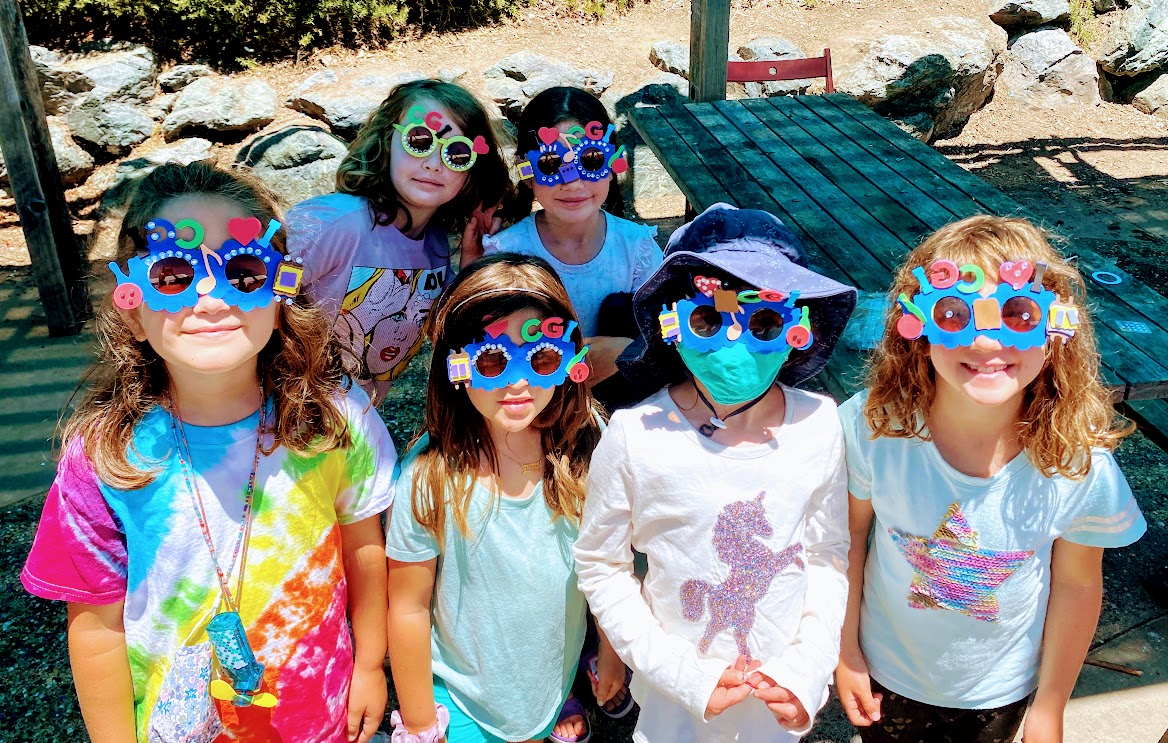 Gan Izzy campers wearing colorful handmade CGI sunglasses